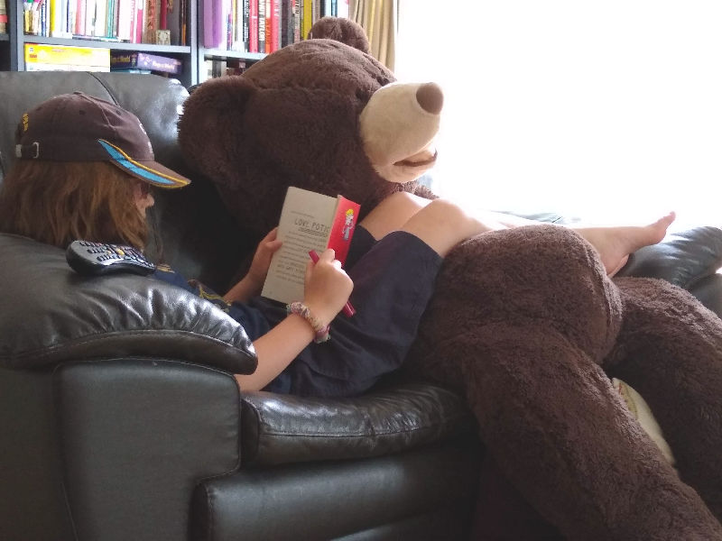 H and Hagrid the bear chilling on the settee