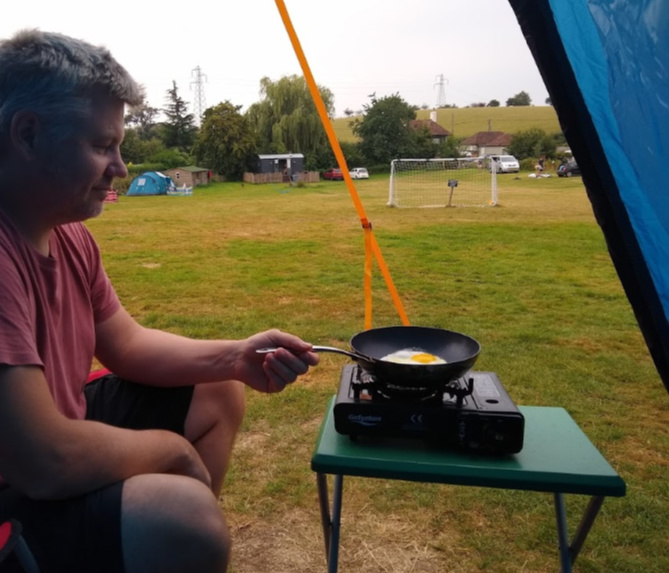 Cooking on a gas stove in the porch area of the Zenobia 6 Eclipse tent. Bought a tent